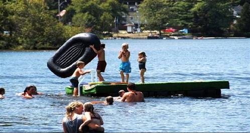 Kids swimming by Kent Waddington