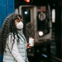 Women wearing covid-19 mask at train station