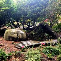 Sculpture of sleeping woman covered in moss in Beacon Hill Park