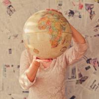 Woman holding a globe