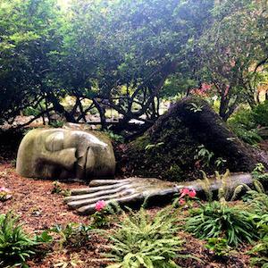 Sculpture of sleeping woman covered in moss in Beacon Hill Park
