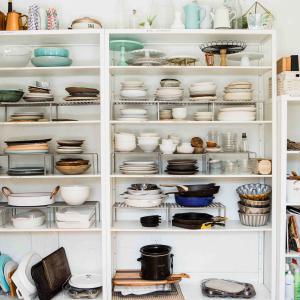 Kitchen shelves with plates, pans and bowls