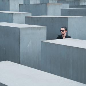 Man standing among concrete blocks