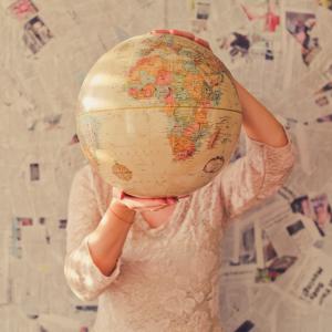 Woman holding a globe