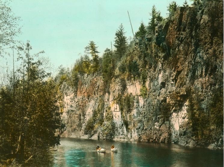 Hand painted photograph of canoes in Algonquin Park, 1920s